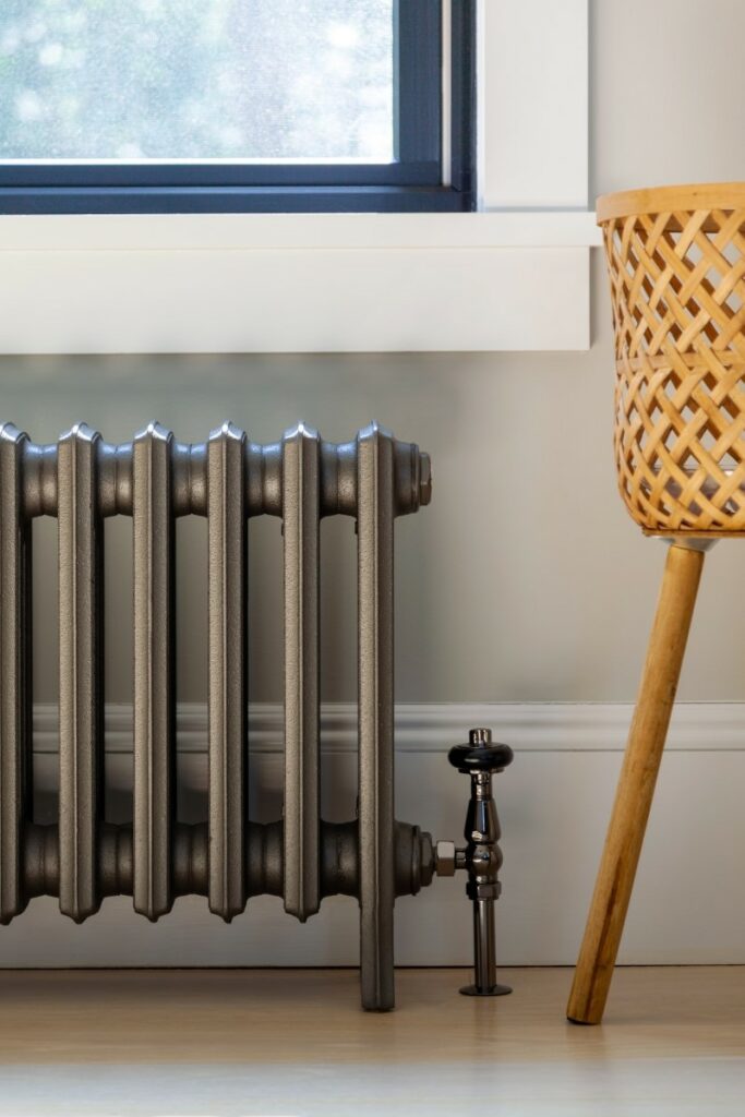 cast iron radiator under window in New Jersey Lakeside home